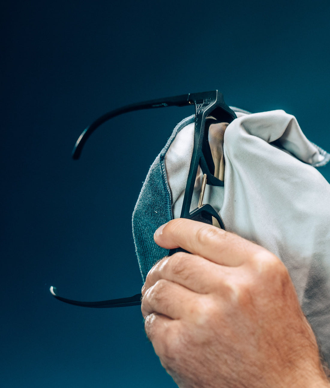 a image of a spectacles cleaning kit standing in water with reflections